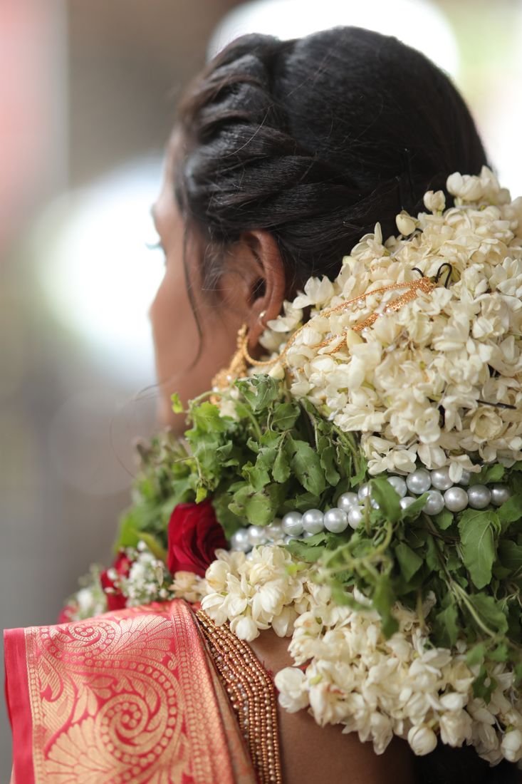 Guruvayur bridal hairstyle - braided bun with jasmine flowers