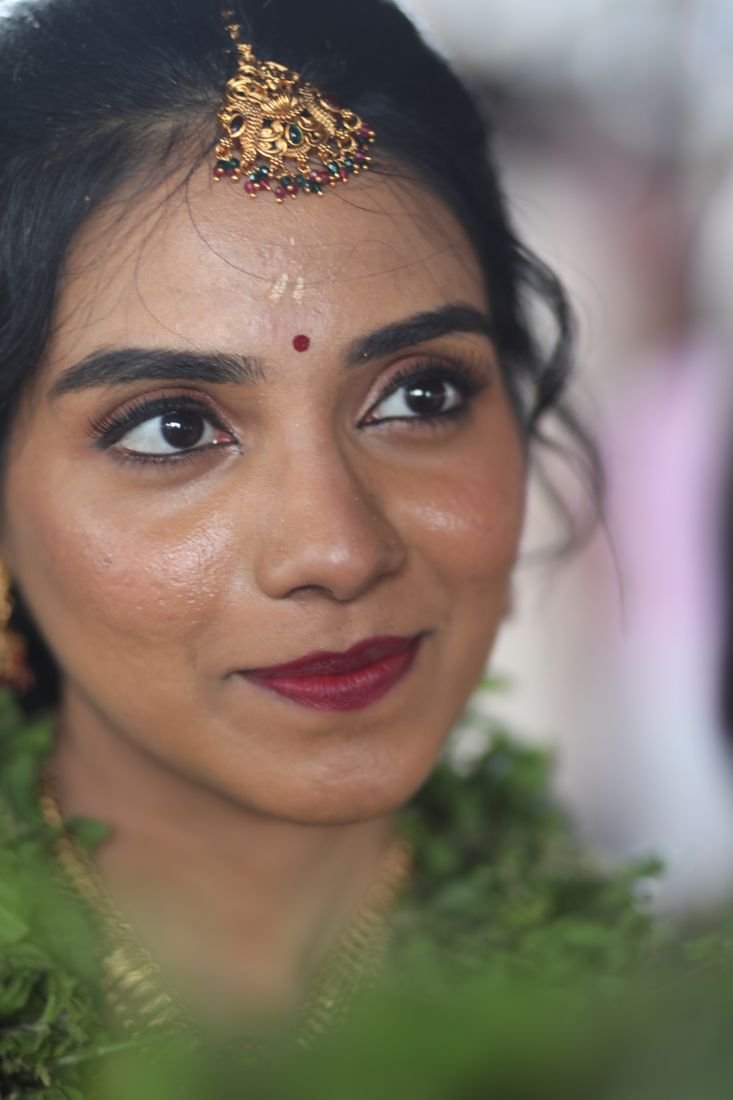 Guruvayur bridal eye makeup - close-up with winged liner and maang tikka