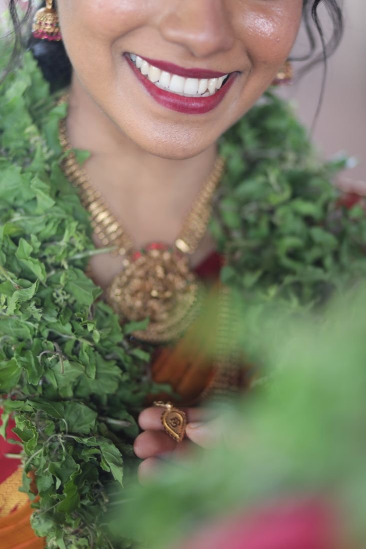 Guruvayur bride makeup - maroon lipstick and temple jewellery close-up