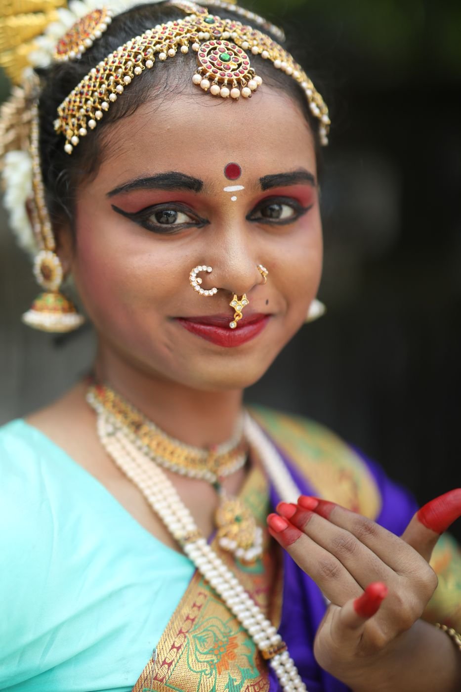 Dance program makeup Guruvayur - Bharatanatyam dancer close-up with red lips and nose rings
