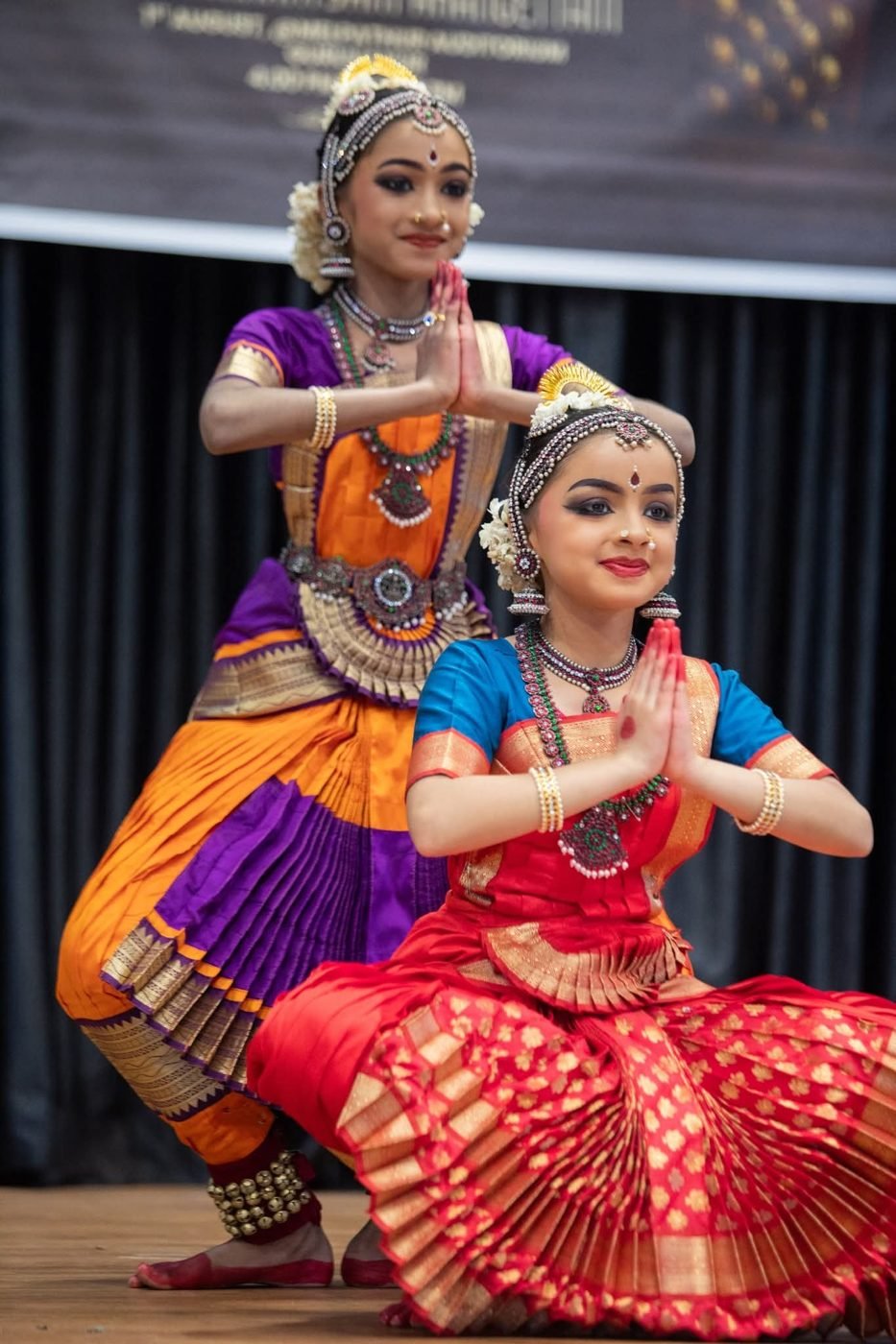 Arangettam dance makeup Guruvayur - two young Bharatanatyam dancers in namaskaram pose