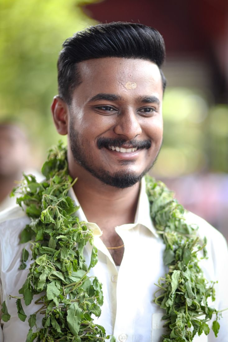 Groom makeup Guruvayur - groom with styled hair and tulasi garland